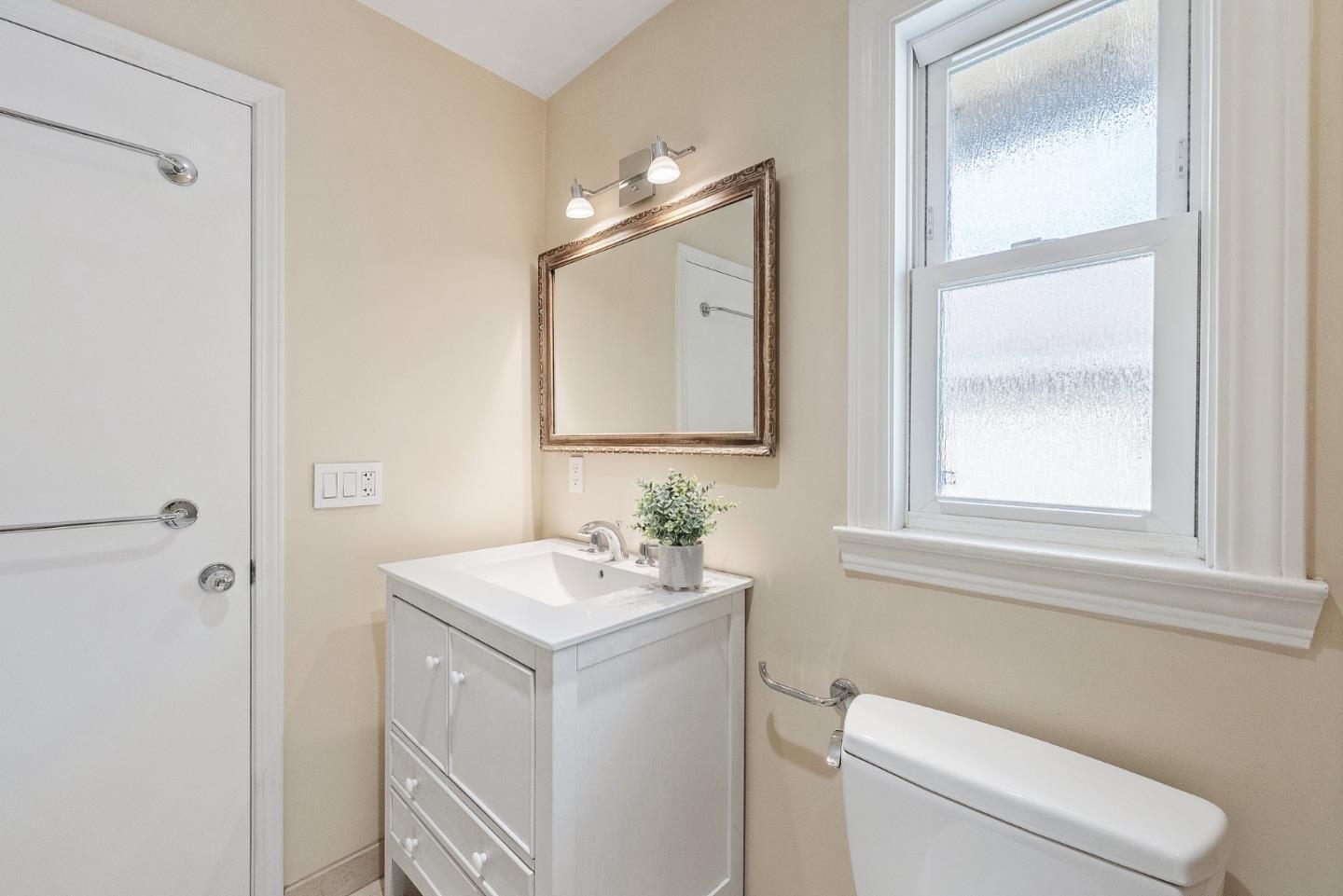 4017 Gold Run Way San Jose, CA 95136 - Photo 18 of 25 a bathroom with a toilet sink and mirror