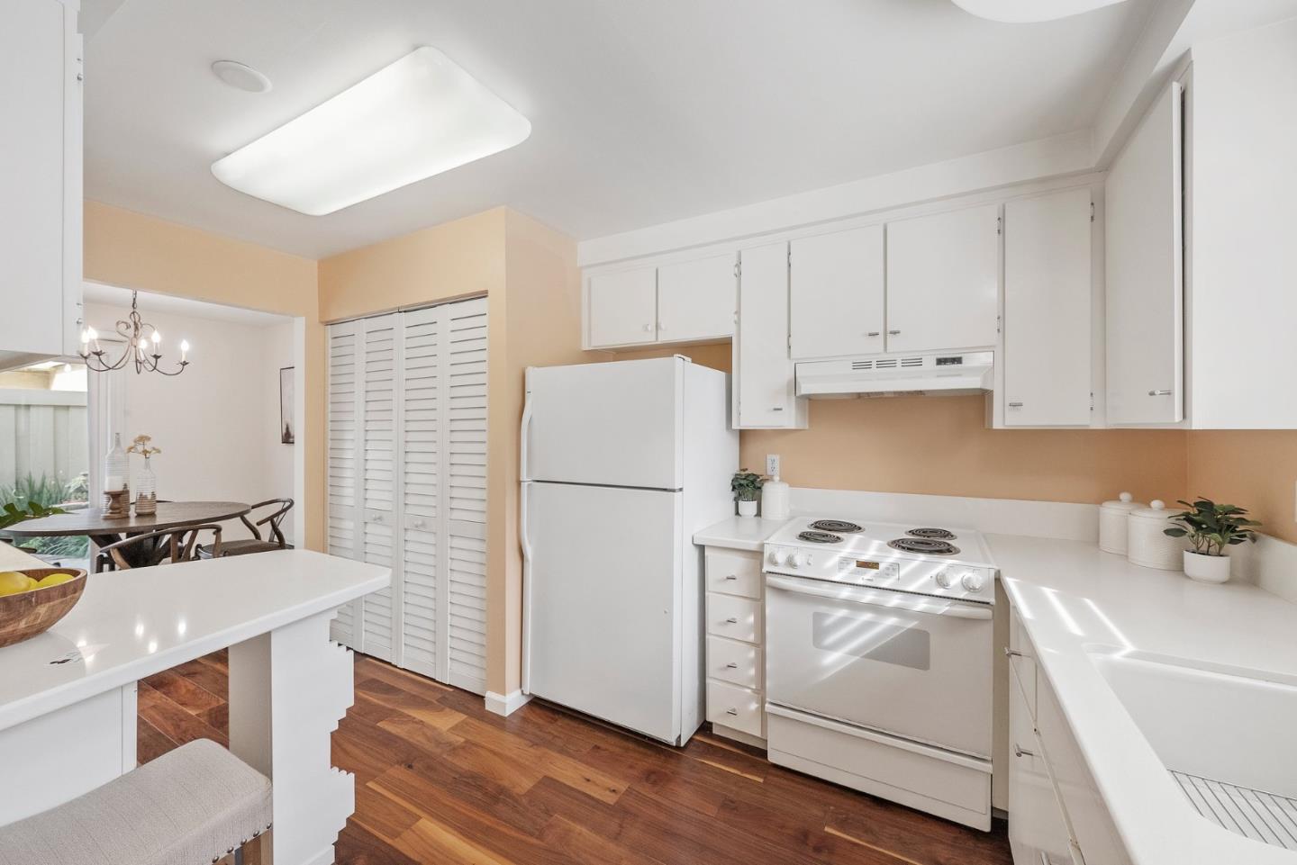 4017 Gold Run Way San Jose, CA 95136 - Photo 9 of 25 a view of kitchen with white cabinets appliances and a sink