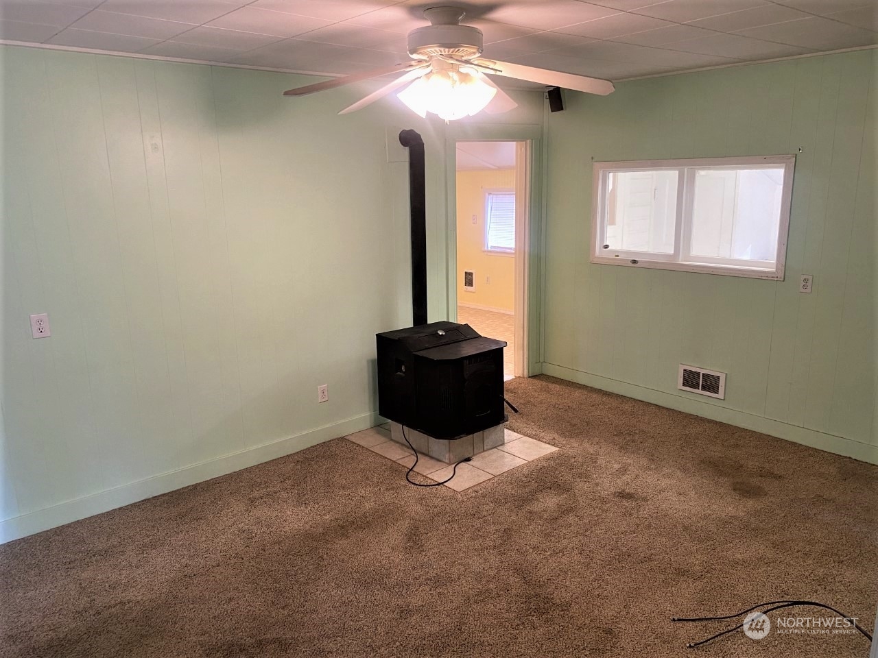 22604 Yeager Road Monroe, WA 98272 - Photo 13 of 21 a room with a chandelier fan and a large window