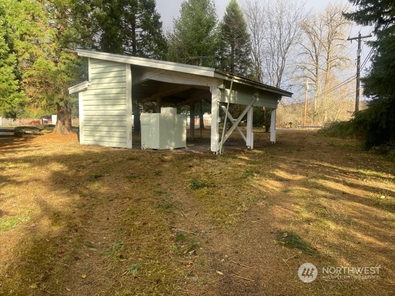 22604 Yeager Road Monroe, WA 98272 - Photo 19 of 21 a view of a house with backyard and a tree