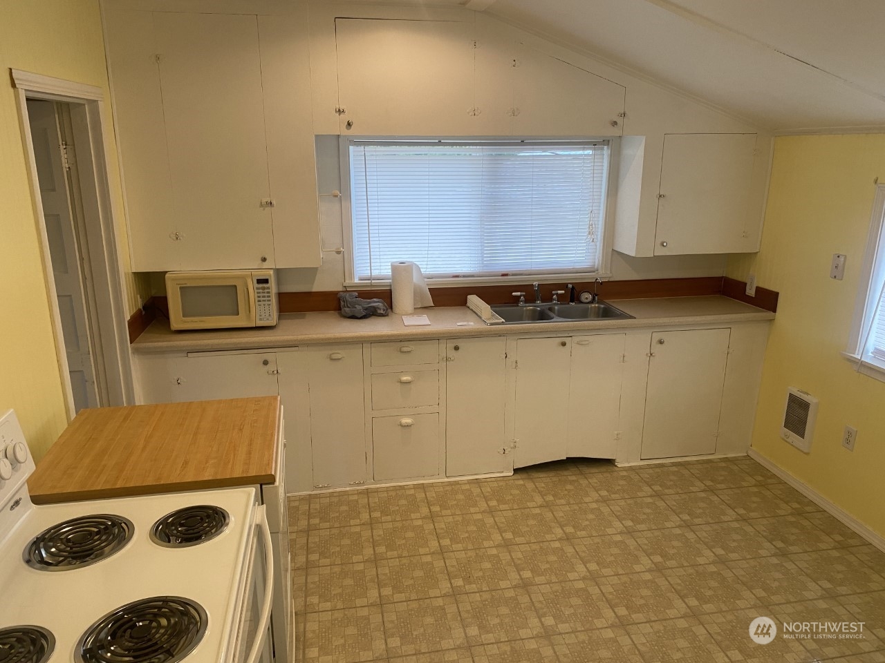 22604 Yeager Road Monroe, WA 98272 - Photo 9 of 21 a kitchen with a sink a stove top oven a counter space and cabinets