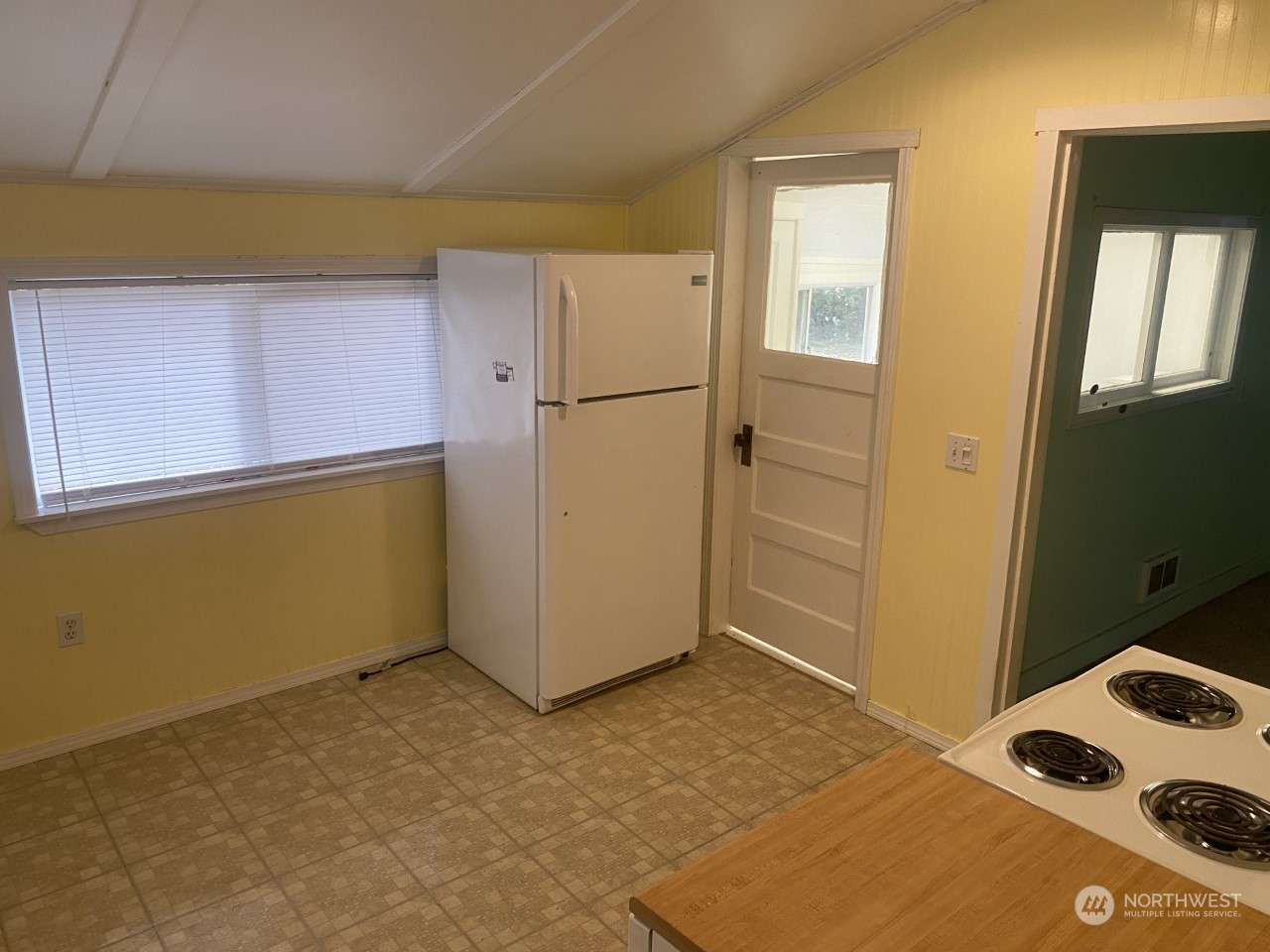 22604 Yeager Road Monroe, WA 98272 - Photo 10 of 21 a view of a refrigerator in kitchen and a window