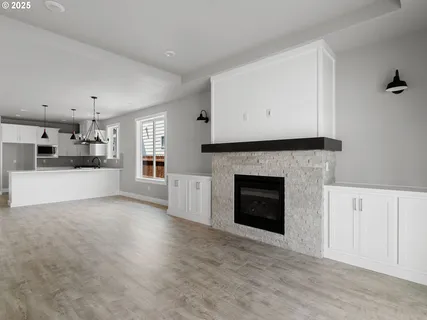 a view of a open kitchen cabinets and a fireplace