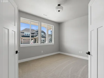 a view of empty room with windows