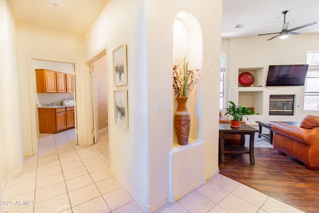 a view of a livingroom with furniture and an empty room