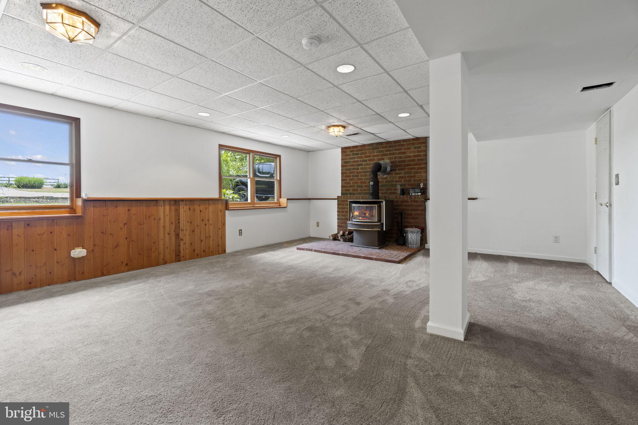 3508 Winding Road Partlow, VA 22534 - Photo 16 of 38 Wide open basement rec-room w/ wood stove!