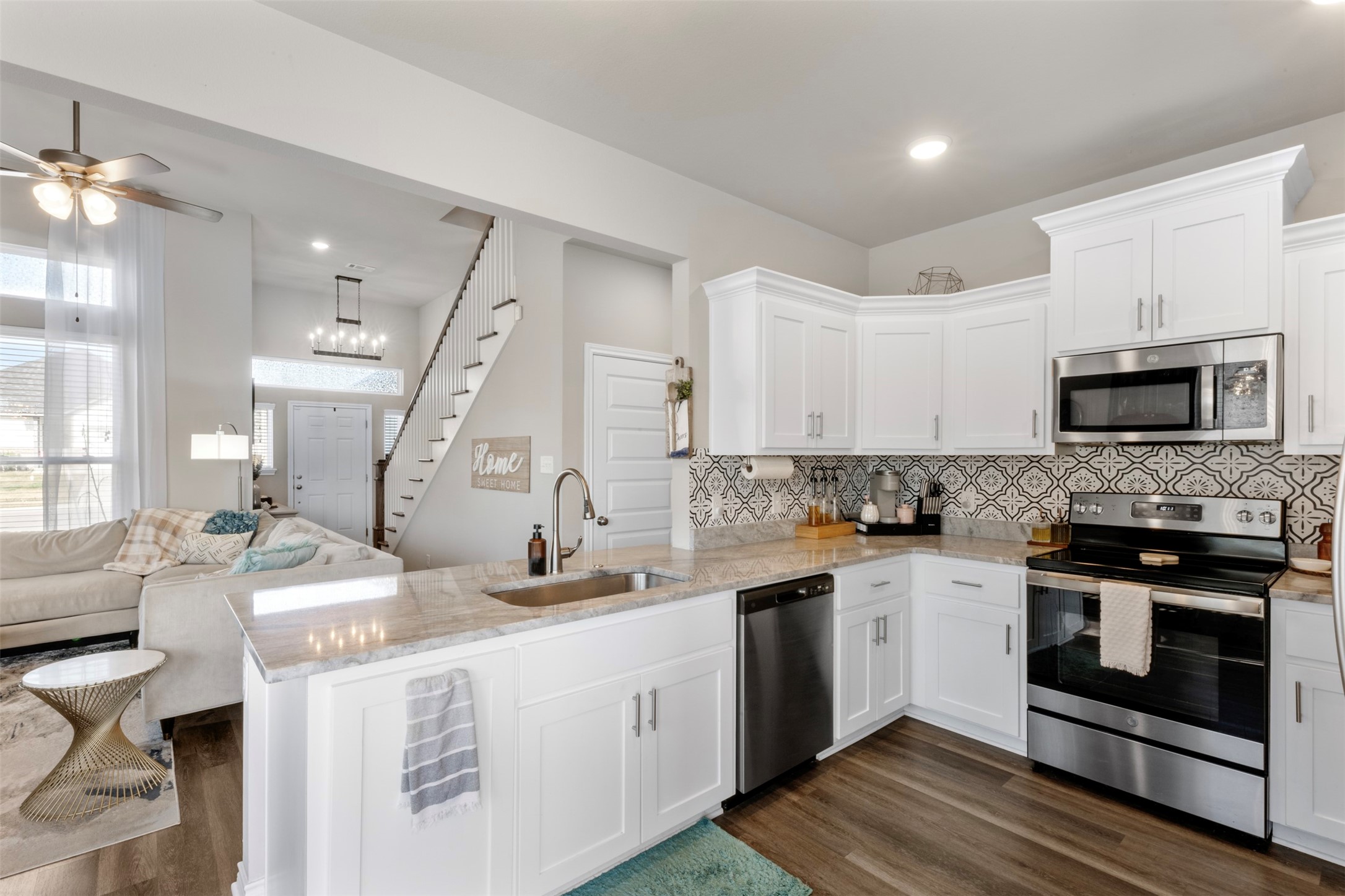 2506 Lightfoot Lane Bryan, TX 77803 - Photo 14 of 47 a kitchen with a sink stove and microwave