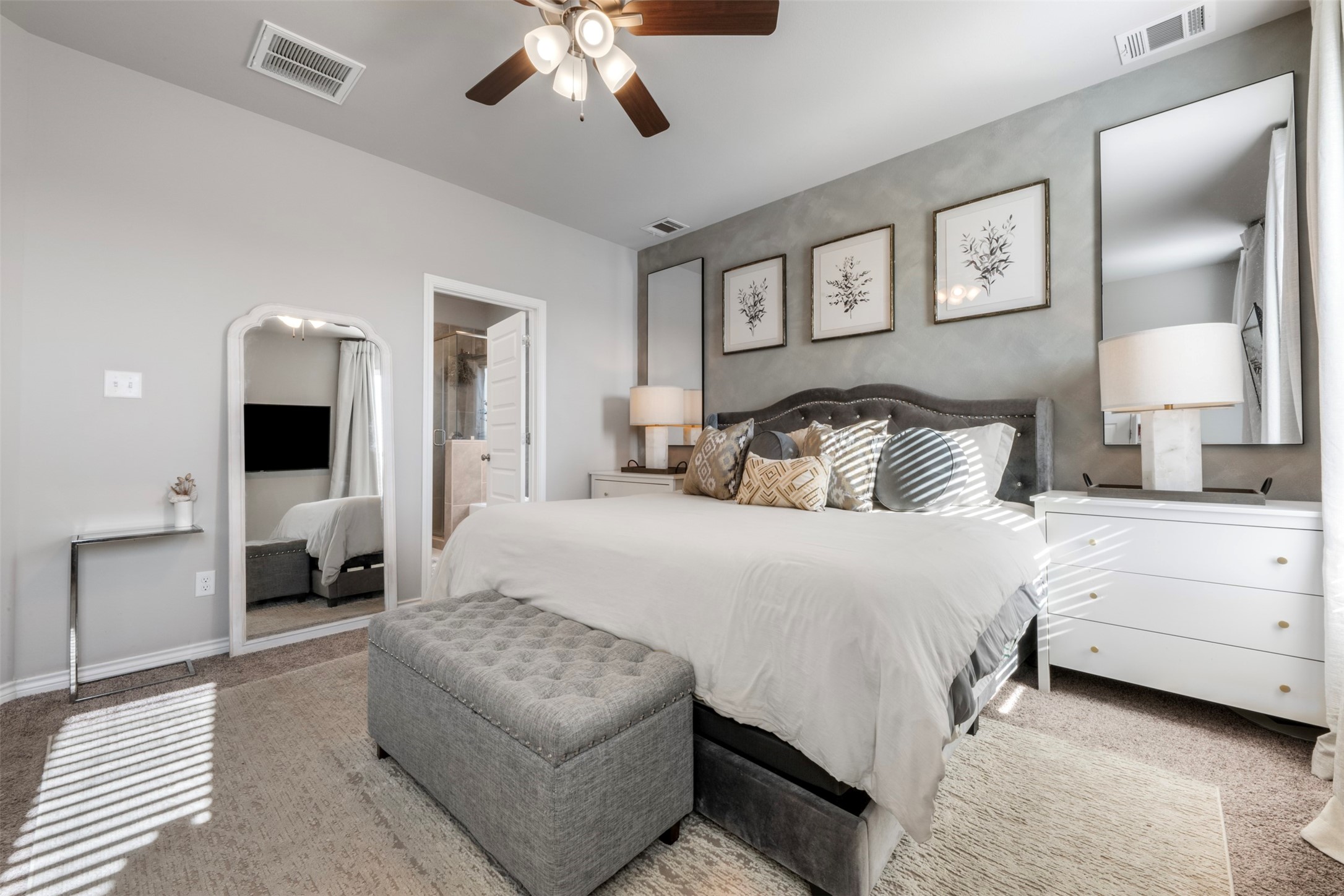 2506 Lightfoot Lane Bryan, TX 77803 - Photo 19 of 47 a bedroom with a large bed and a chandelier