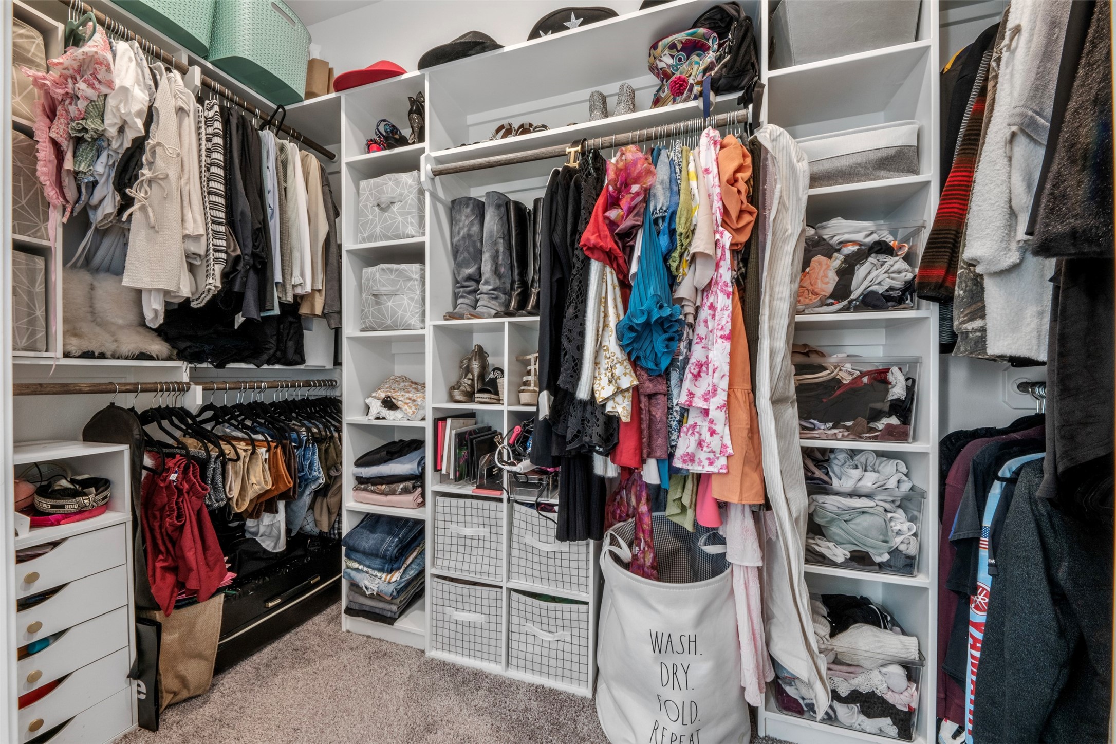 2506 Lightfoot Lane Bryan, TX 77803 - Photo 20 of 47 a view of walk in closet with clothes and shoes