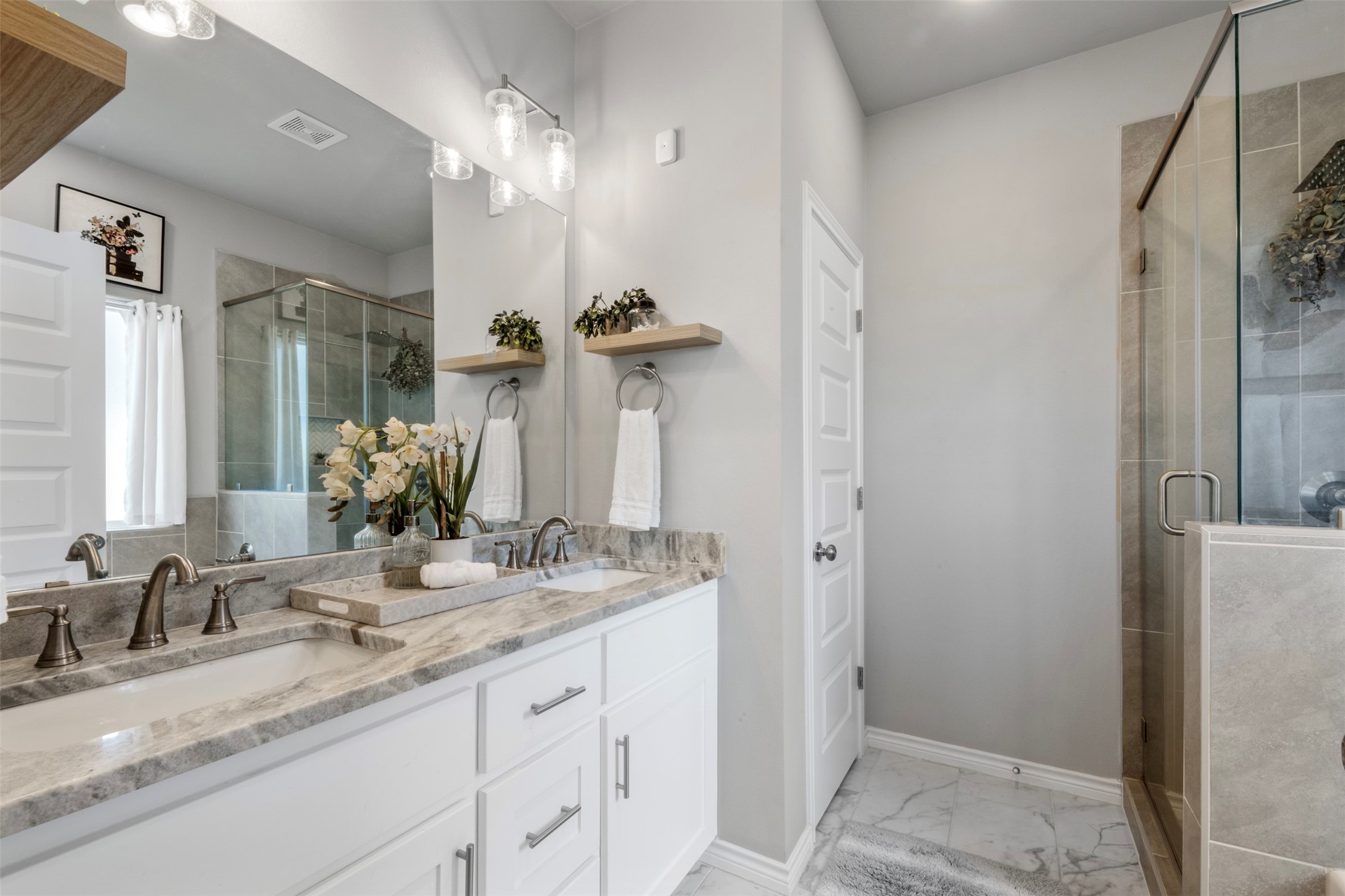 2506 Lightfoot Lane Bryan, TX 77803 - Photo 22 of 47 a bathroom with a granite countertop sink and a mirror