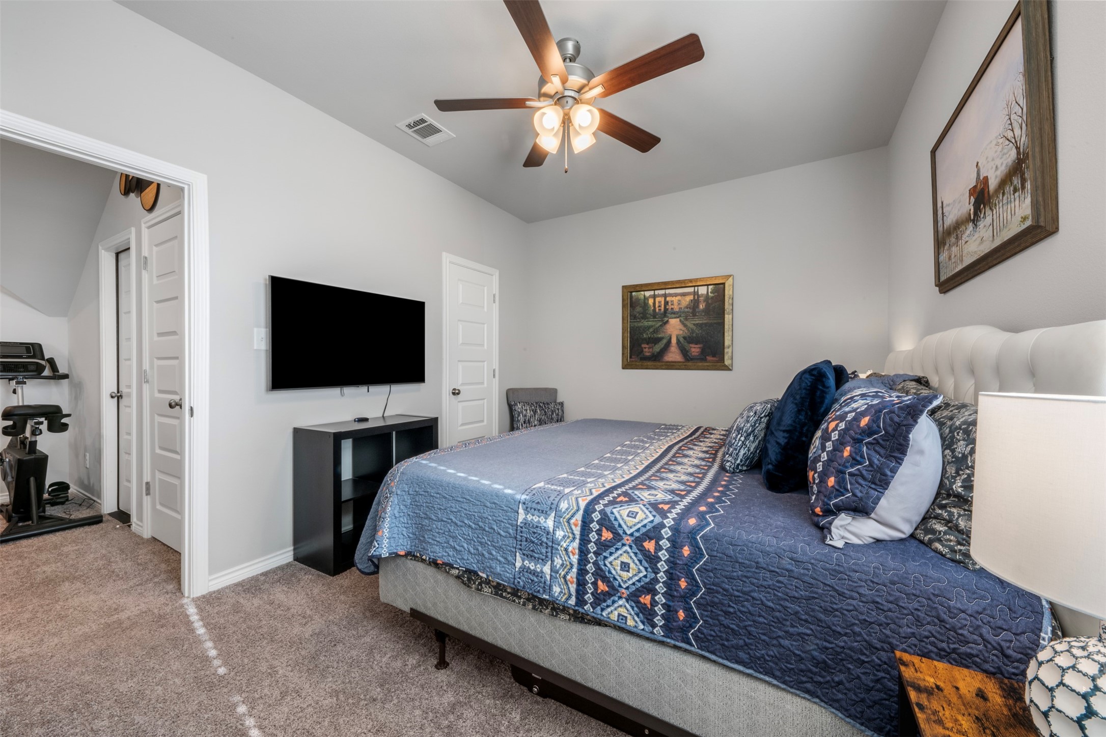 2506 Lightfoot Lane Bryan, TX 77803 - Photo 28 of 47 a bedroom with a bed and a flat screen tv