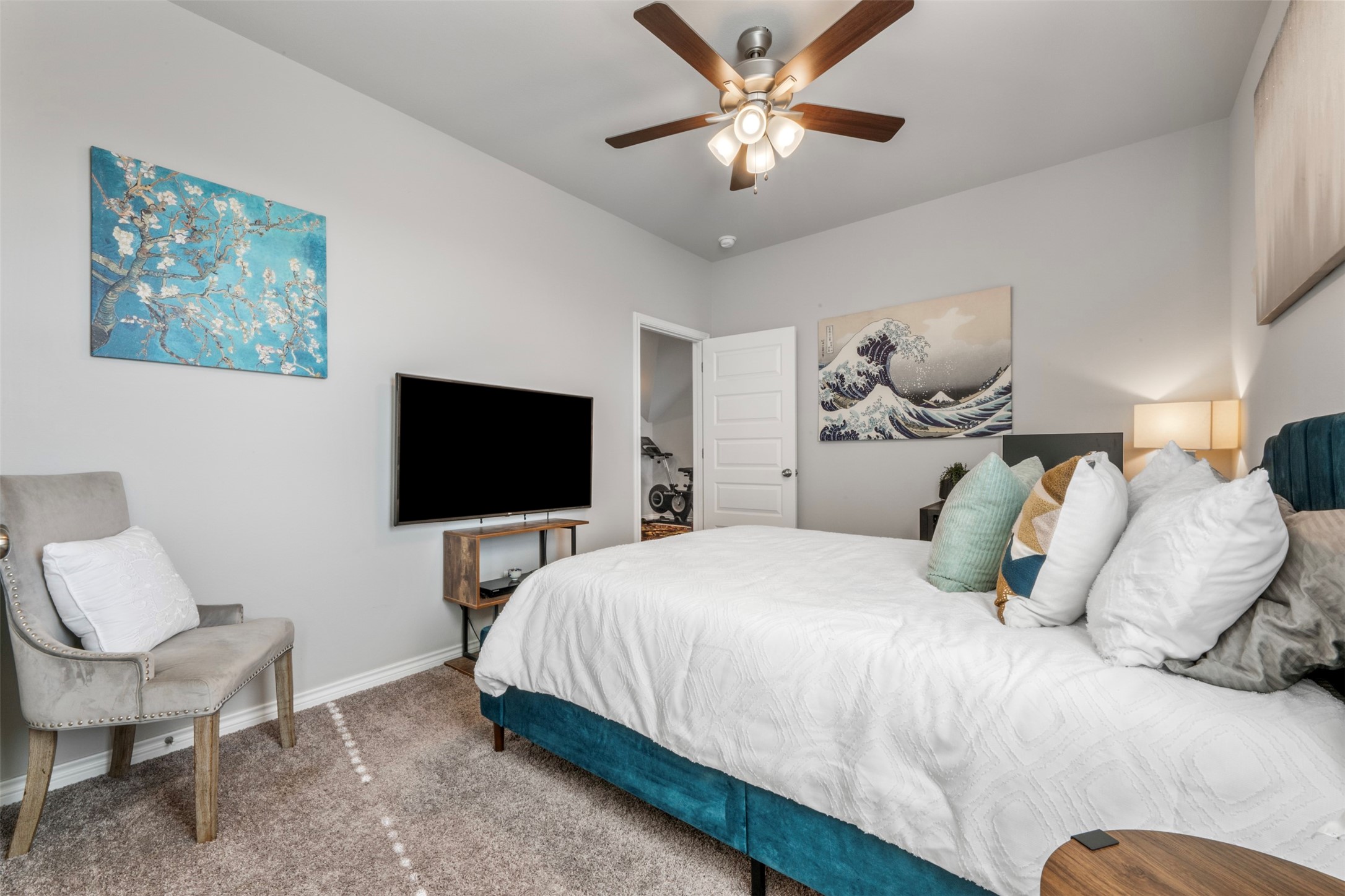 2506 Lightfoot Lane Bryan, TX 77803 - Photo 30 of 47 a bedroom with a large bed and a flat screen tv