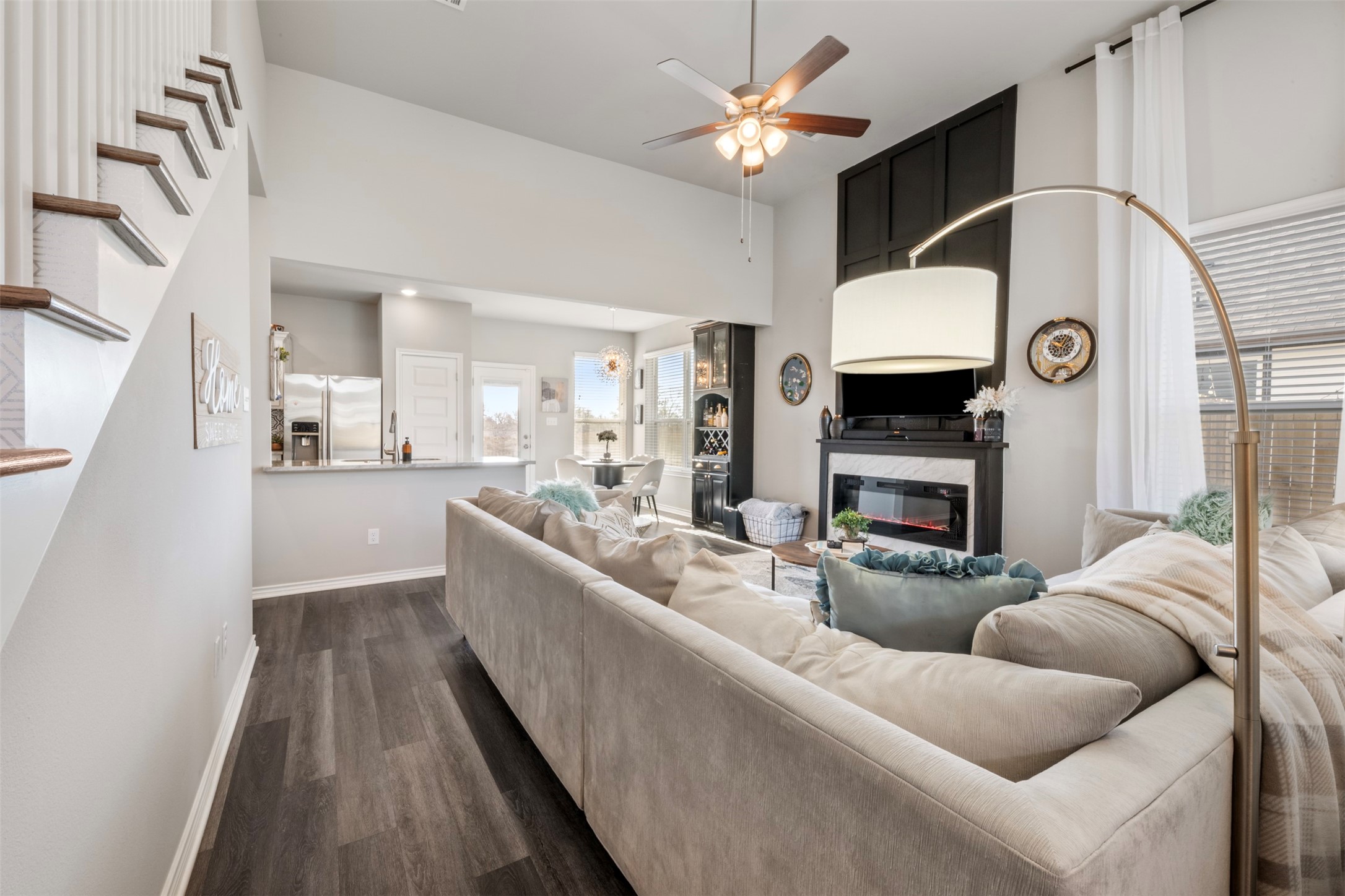 2506 Lightfoot Lane Bryan, TX 77803 - Photo 8 of 47 a living room with furniture a fireplace and a ceiling fan