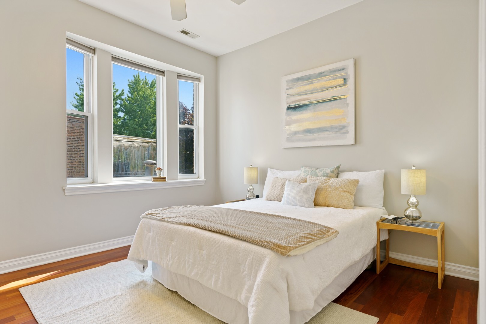 4440 North Dover Street, Unit 3S Chicago, IL 60640 - Photo 11 of 20 a bedroom with a bed and a large window