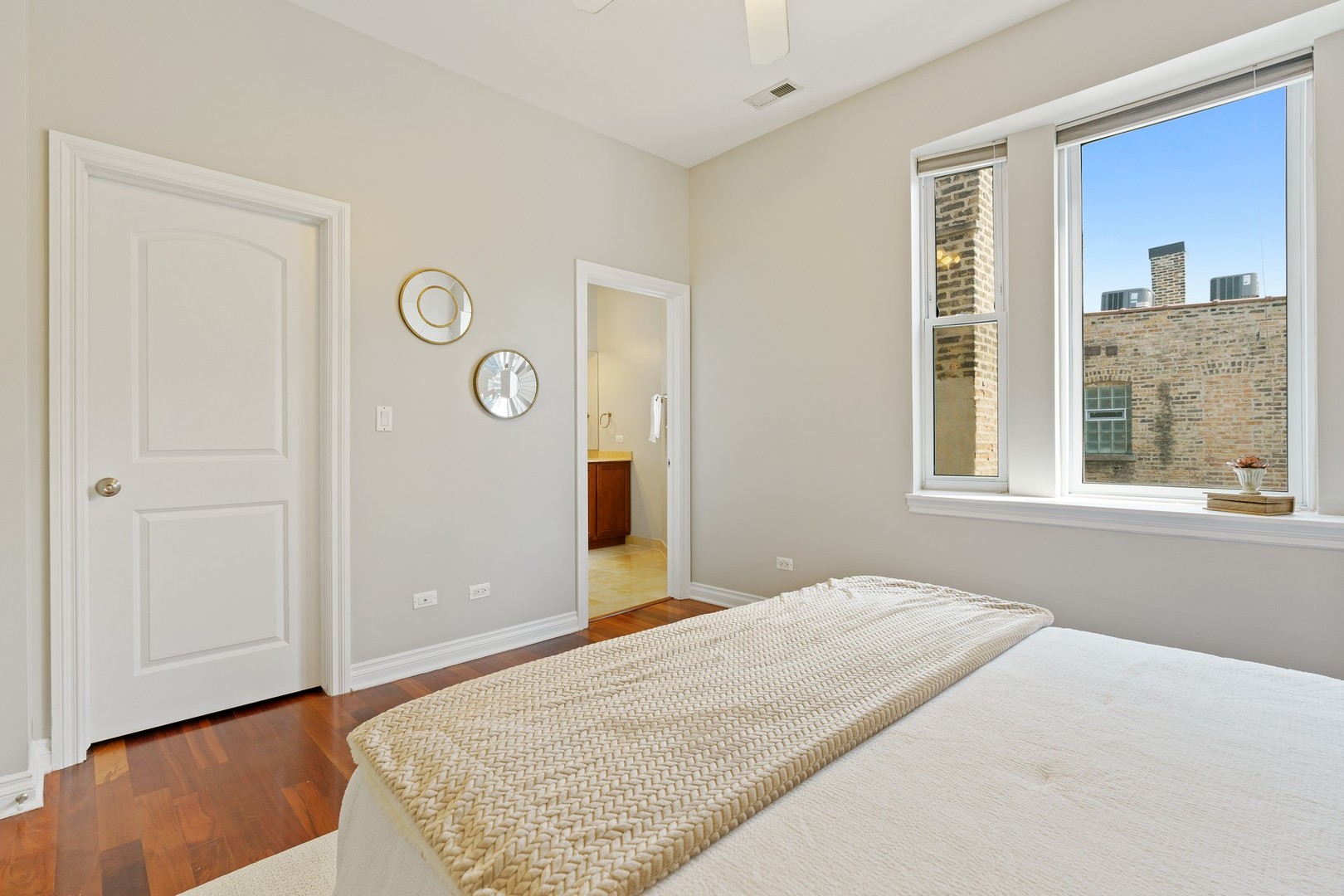 4440 North Dover Street, Unit 3S Chicago, IL 60640 - Photo 12 of 20 a bedroom with a bed and a window