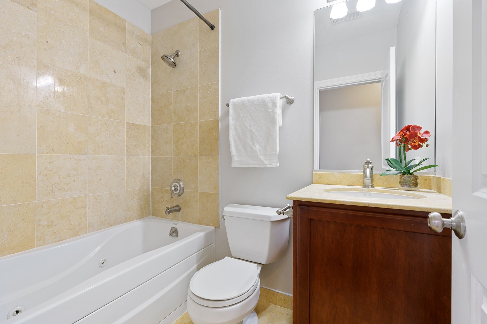 4440 North Dover Street, Unit 3S Chicago, IL 60640 - Photo 18 of 20 a bathroom with a sink a toilet and shower