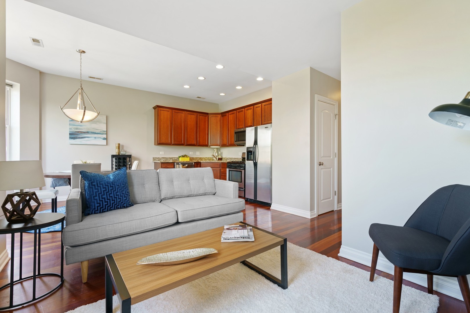 4440 North Dover Street, Unit 3S Chicago, IL 60640 - Photo 4 of 20 a living room with furniture and kitchen view
