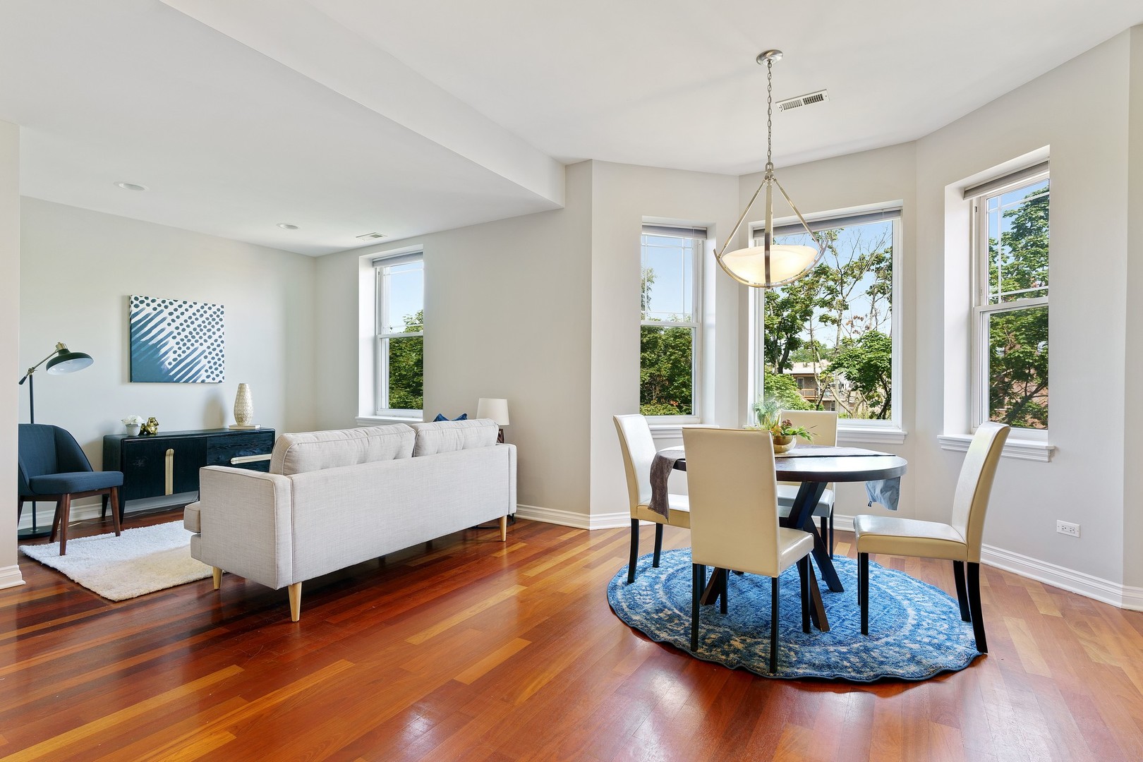 4440 North Dover Street, Unit 3S Chicago, IL 60640 - Photo 9 of 20 a living room with furniture large window and wooden floor