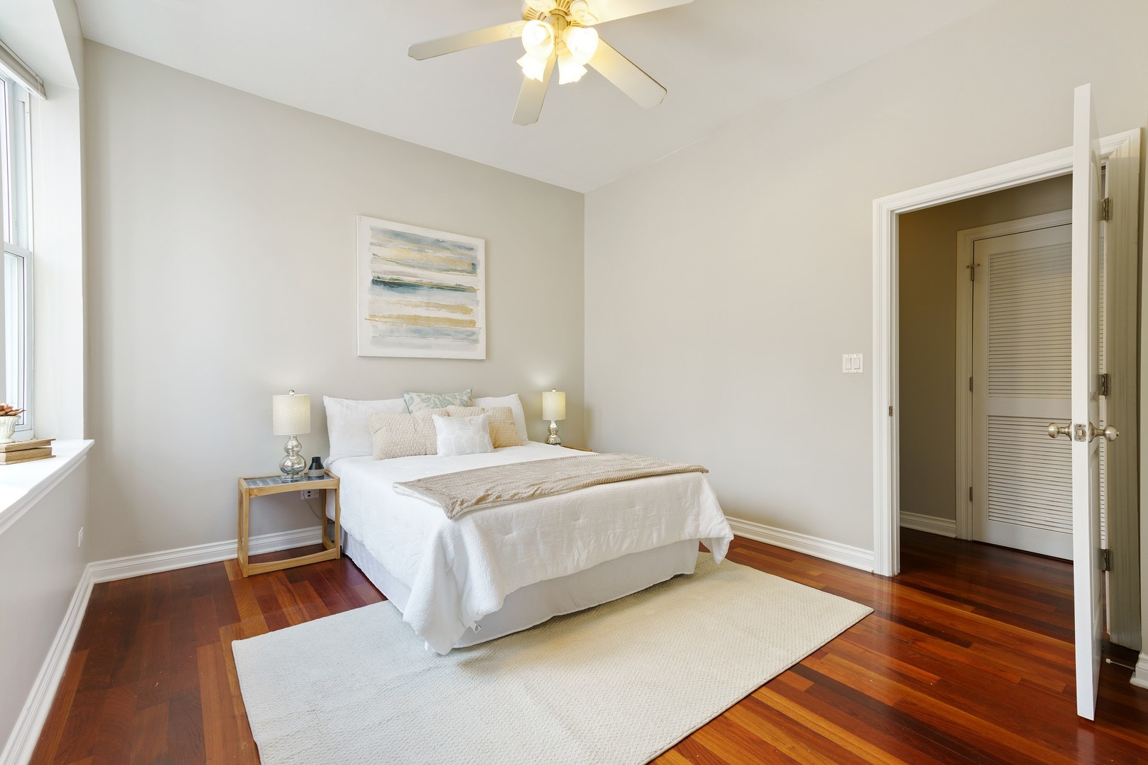 4440 North Dover Street, Unit 3S Chicago, IL 60640 - Photo 10 of 20 a bed room with a bed and a chandelier