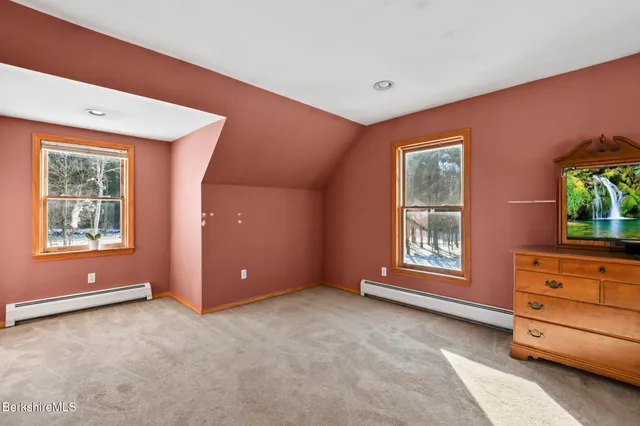 an empty room with windows cabinet and windows