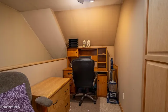 a view of workspace with lounge chair