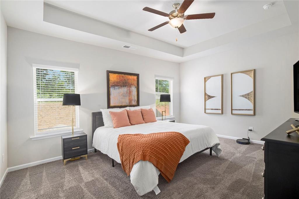 152 Malbone Street Southwest Cartersville, GA 30120 - Photo 17 of 31 a bedroom with a bed and window