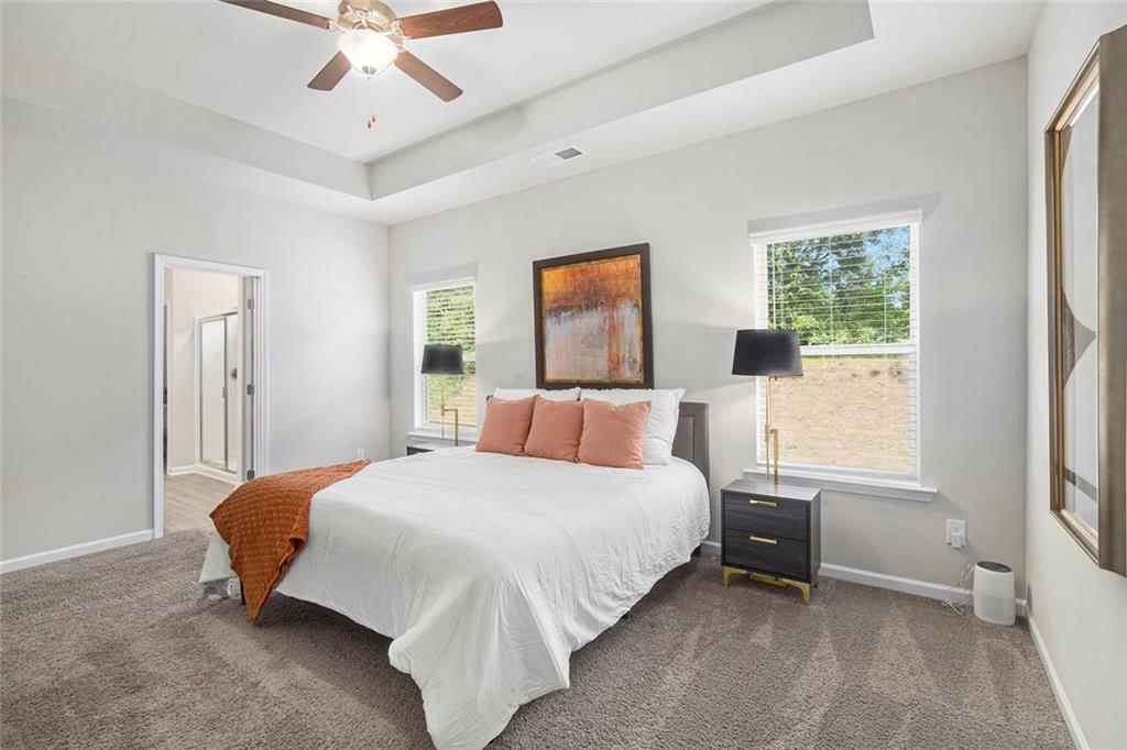 152 Malbone Street Southwest Cartersville, GA 30120 - Photo 18 of 31 a bedroom with a bed and window