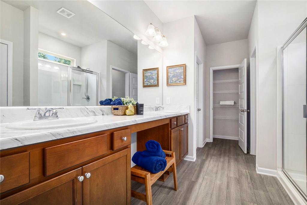 152 Malbone Street Southwest Cartersville, GA 30120 - Photo 20 of 31 a spacious bathroom with a sink mirror and vanity