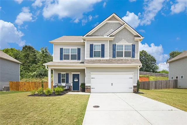a front view of a house with a yard