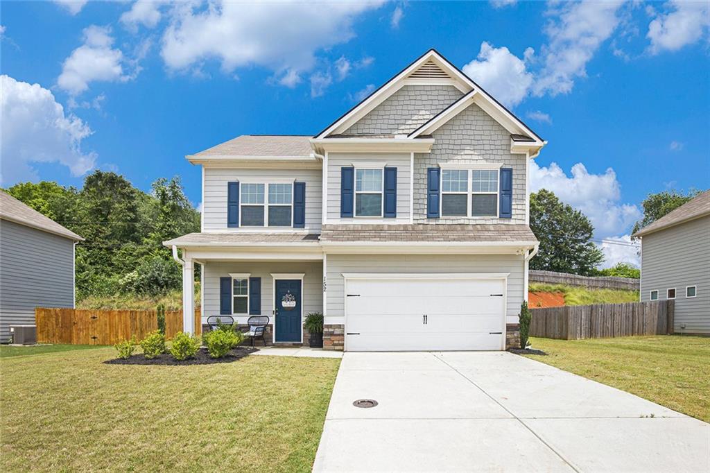 152 Malbone Street Southwest Cartersville, GA 30120 - Photo 2 of 31 a front view of a house with a yard