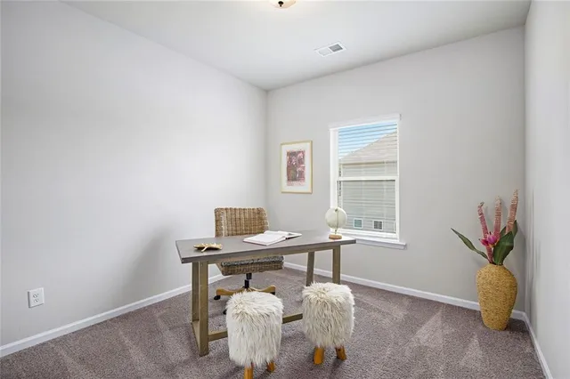 a view of a workspace with furniture