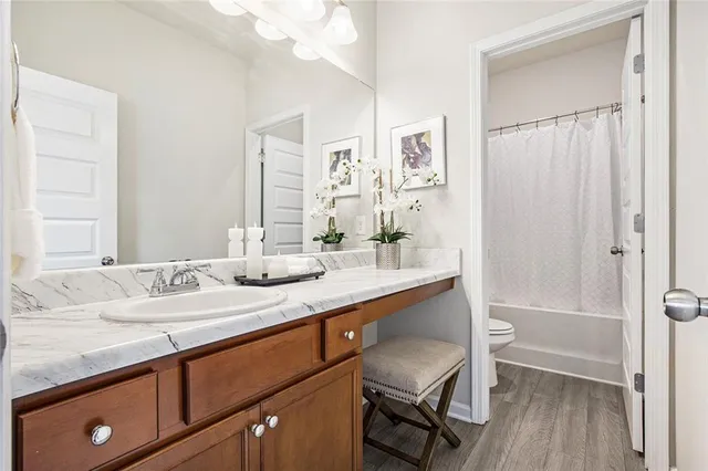 a bathroom with a sink a mirror and a shower