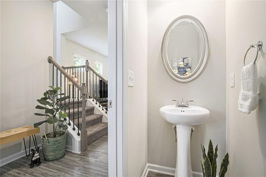 152 Malbone Street Southwest Cartersville, GA 30120 - Photo 5 of 31 a bathroom with a sink a mirror and a window