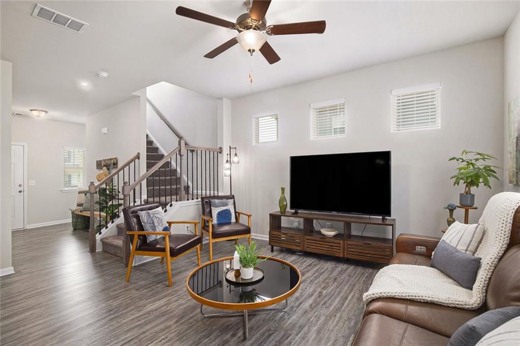 152 Malbone Street Southwest Cartersville, GA 30120 - Photo 8 of 31 a living room with furniture and a flat screen tv