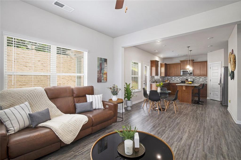 152 Malbone Street Southwest Cartersville, GA 30120 - Photo 9 of 31 a living room with furniture kitchen and a large window