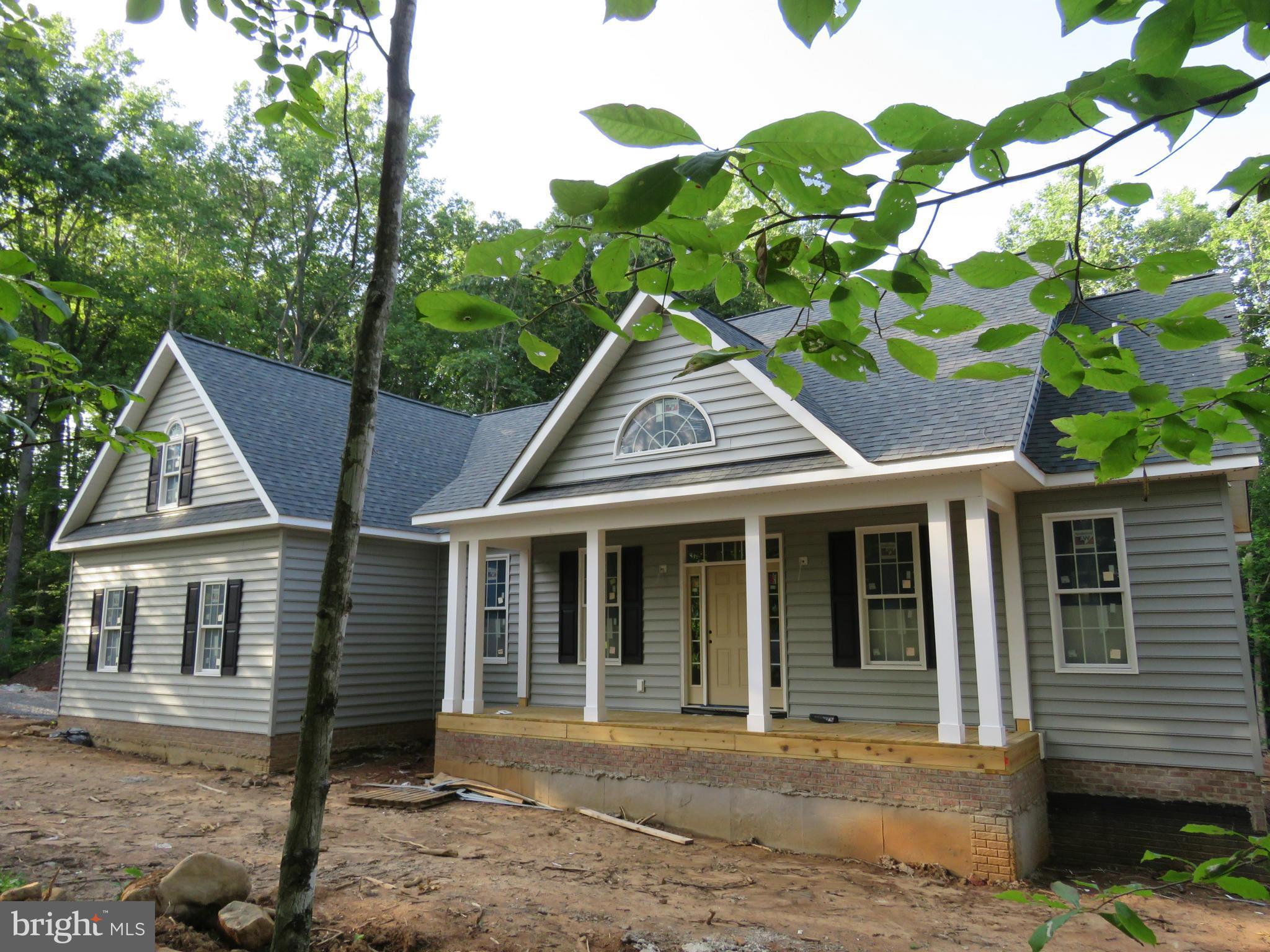 10607 Dutch Hollow Road Rixeyville, VA 22737 - Photo 1 of 1 a front view of a house with garden
