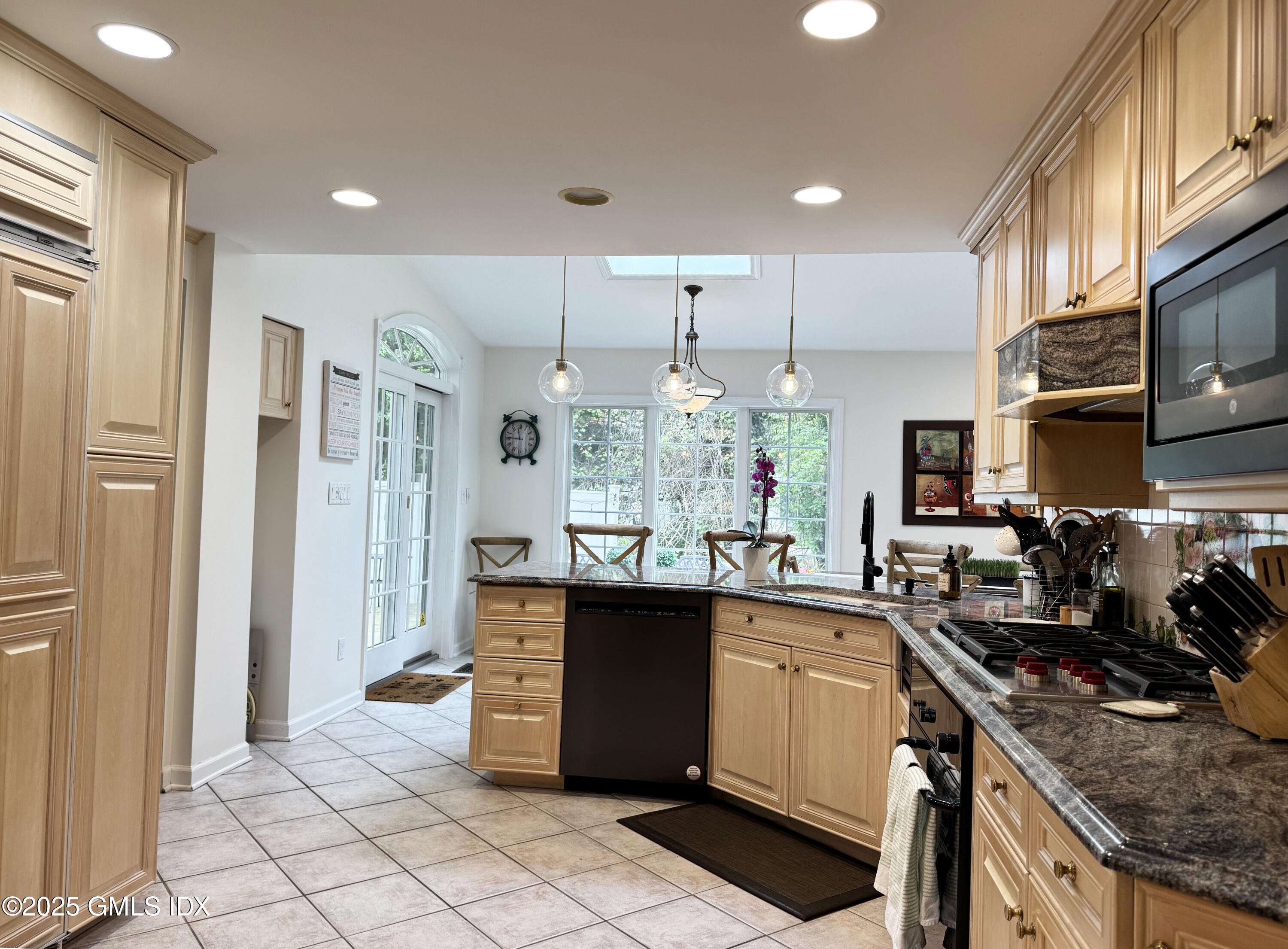 30 Split Timber Place Riverside, CT 06878 - Photo 14 of 49 a kitchen with stainless steel appliances granite countertop a sink and cabinets