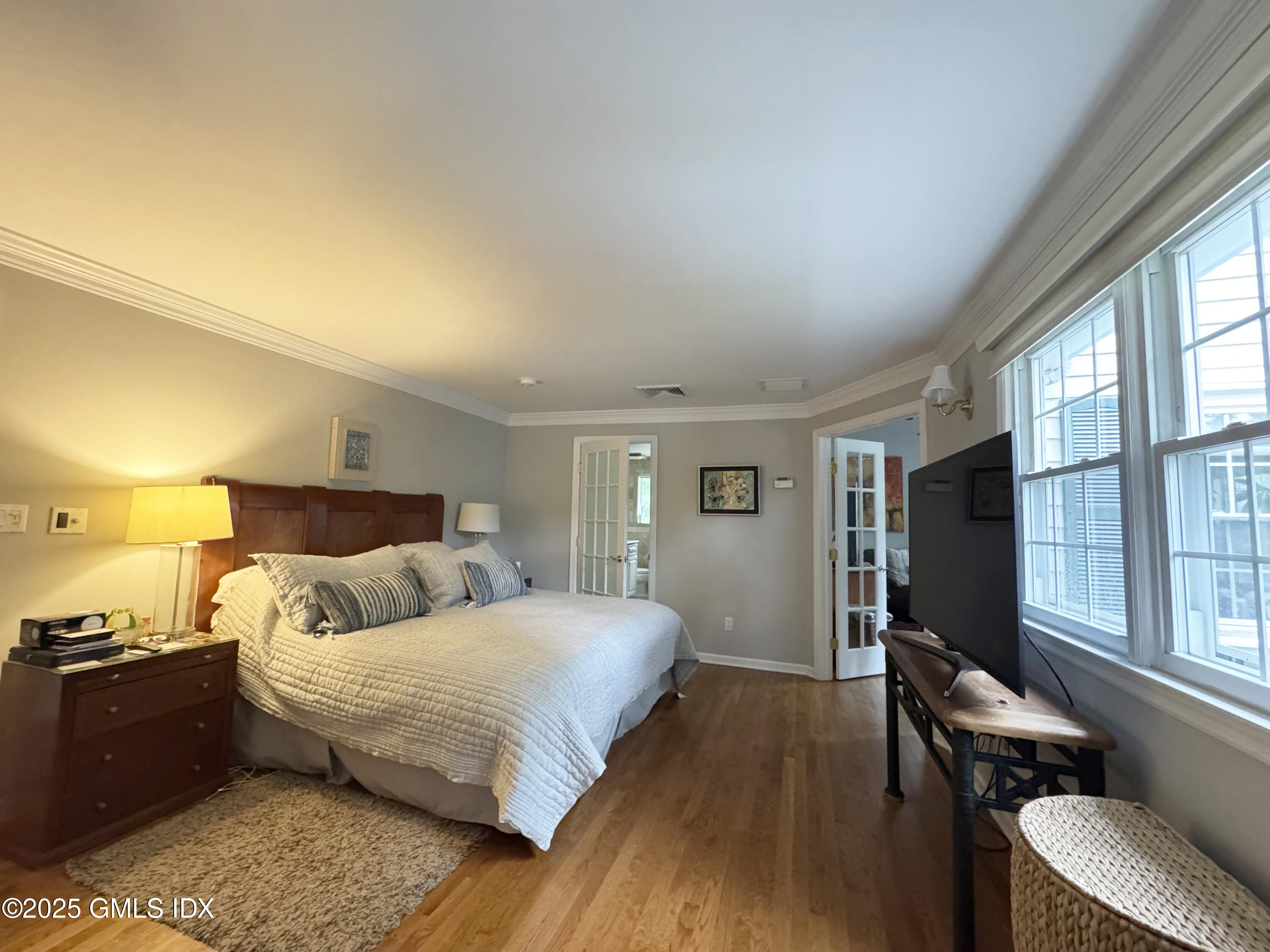 30 Split Timber Place Riverside, CT 06878 - Photo 29 of 49 a bedroom with a bed and wooden floor