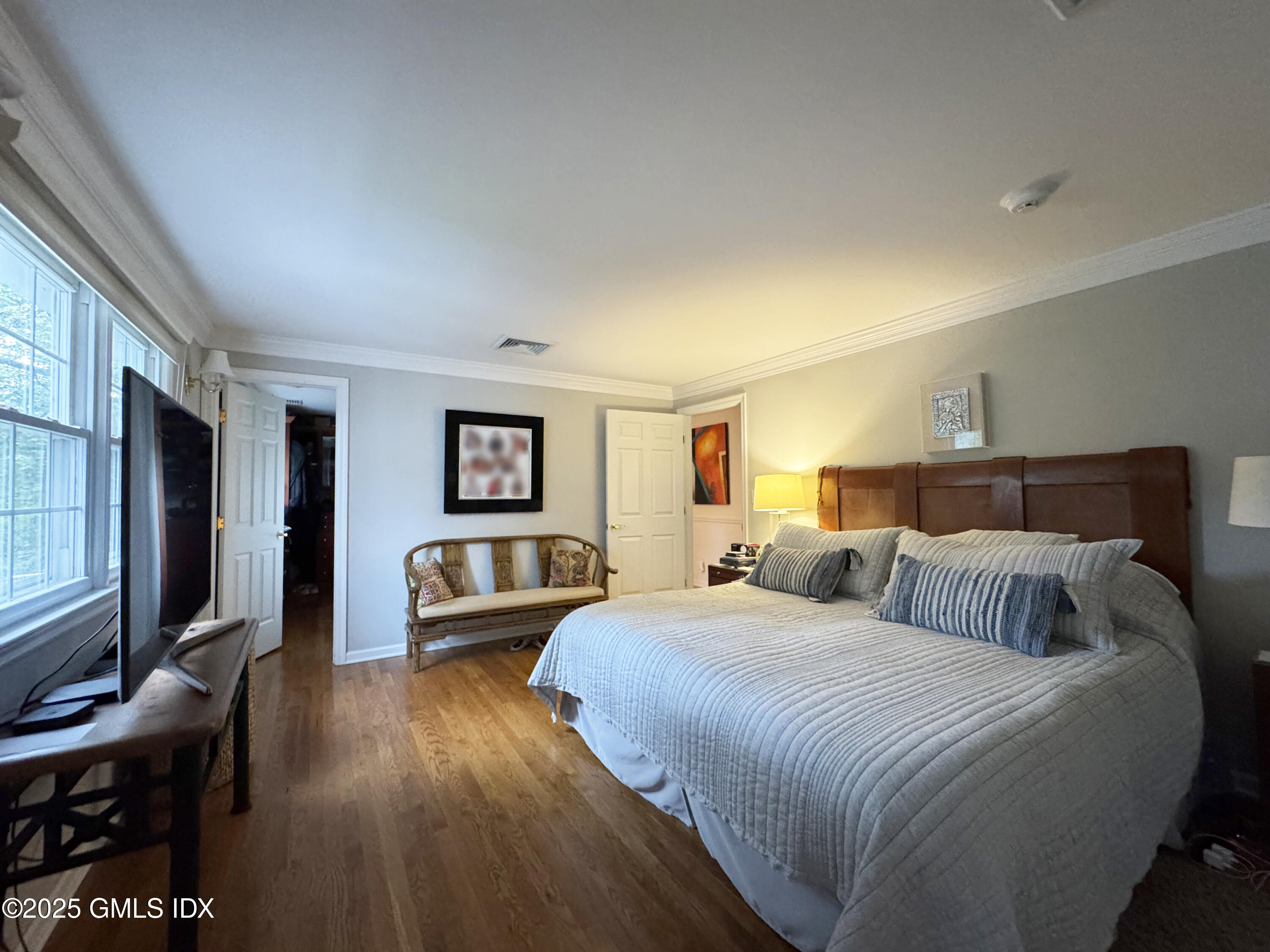 30 Split Timber Place Riverside, CT 06878 - Photo 30 of 49 a bedroom with a bed and a flat screen tv