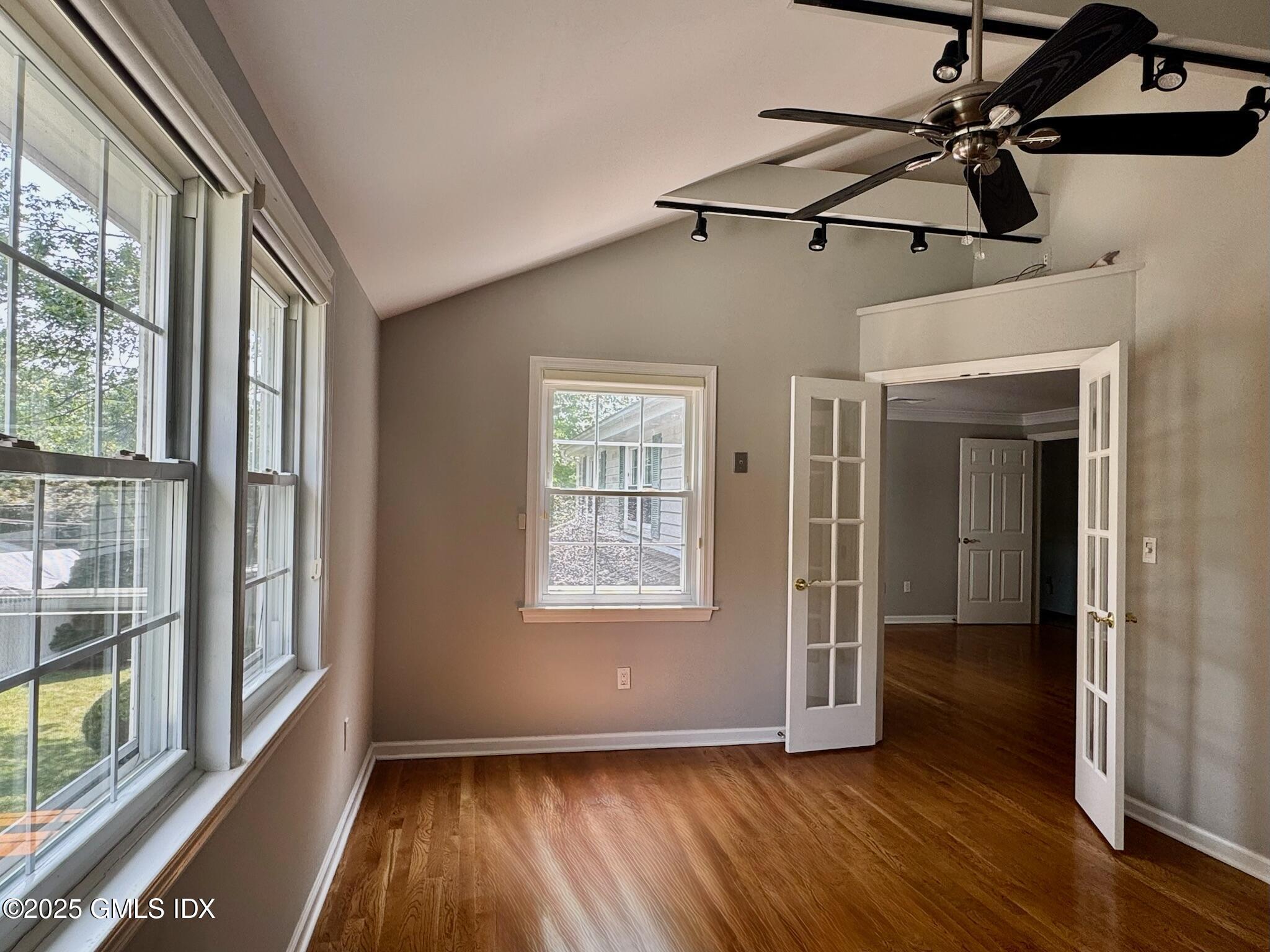 30 Split Timber Place Riverside, CT 06878 - Photo 36 of 49 an empty room with wooden floor fan and windows