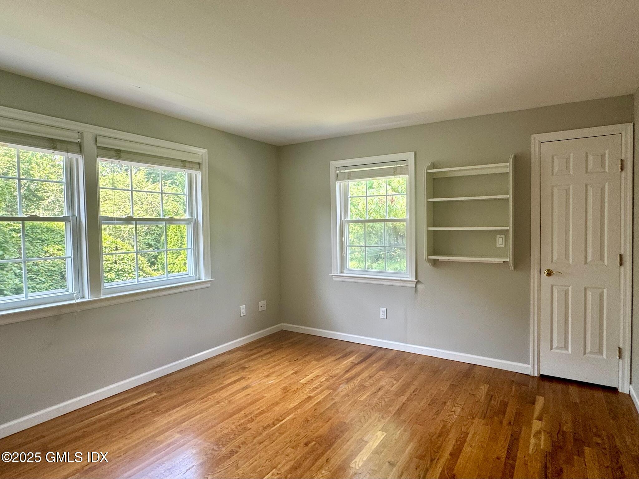 30 Split Timber Place Riverside, CT 06878 - Photo 46 of 49 wooden floor in an empty room with a window