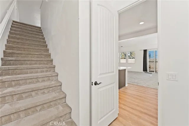 a living room with furniture and white walls