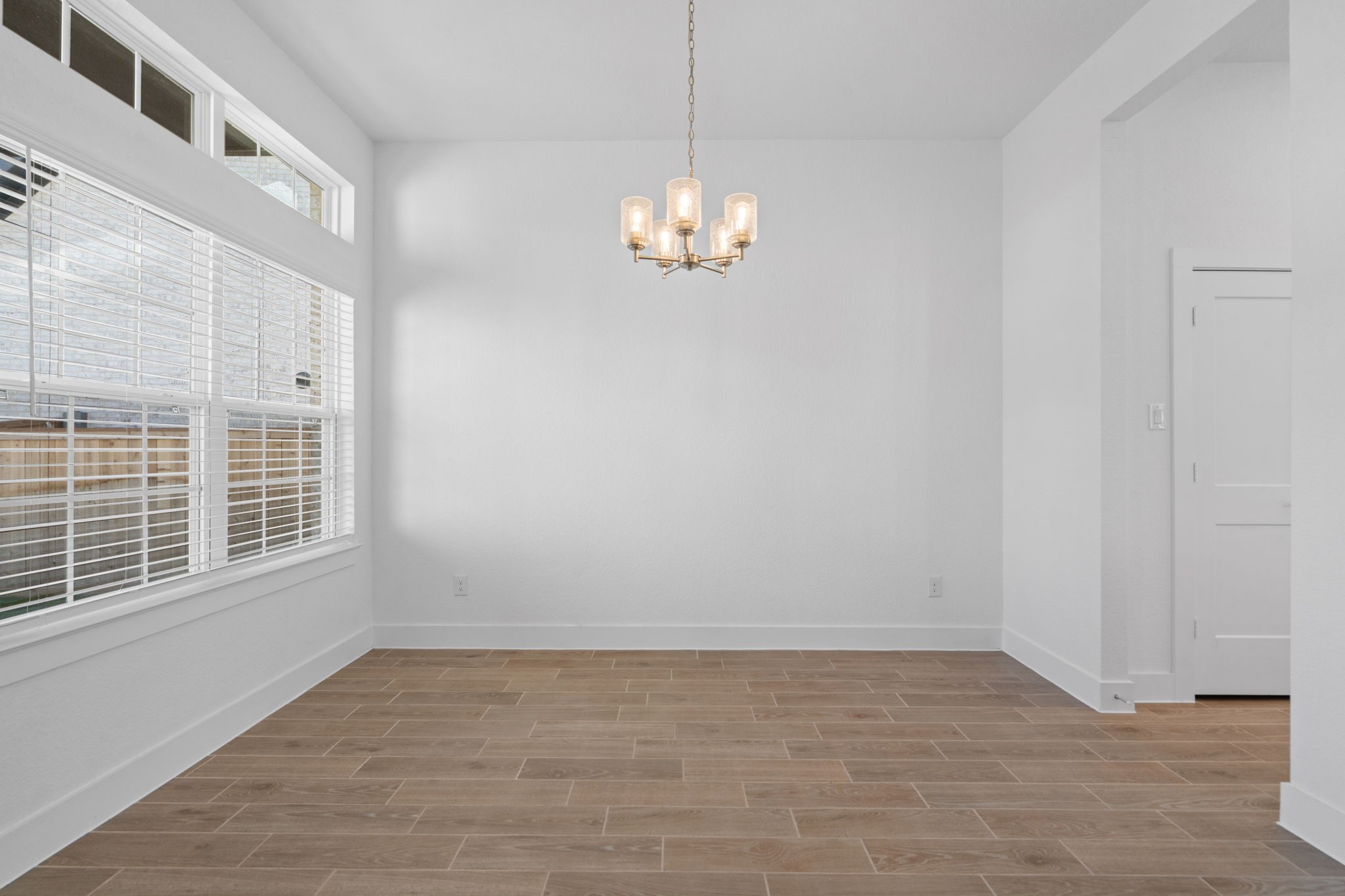 22618 Basswood Bnd Road Waller, TX 77484 - Photo 13 of 36 a view of a livingroom with a chandelier