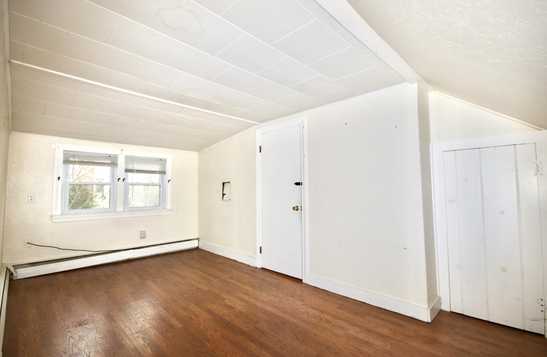 46 Fisher Road Hyannis, MA 02601 - Photo 14 of 29 an empty room with wooden floor and windows