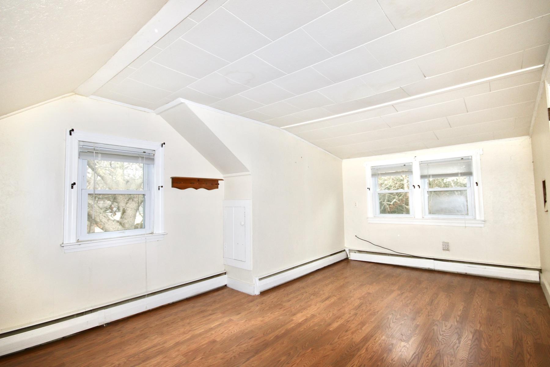 46 Fisher Road Hyannis, MA 02601 - Photo 15 of 29 an empty room with wooden floor and windows