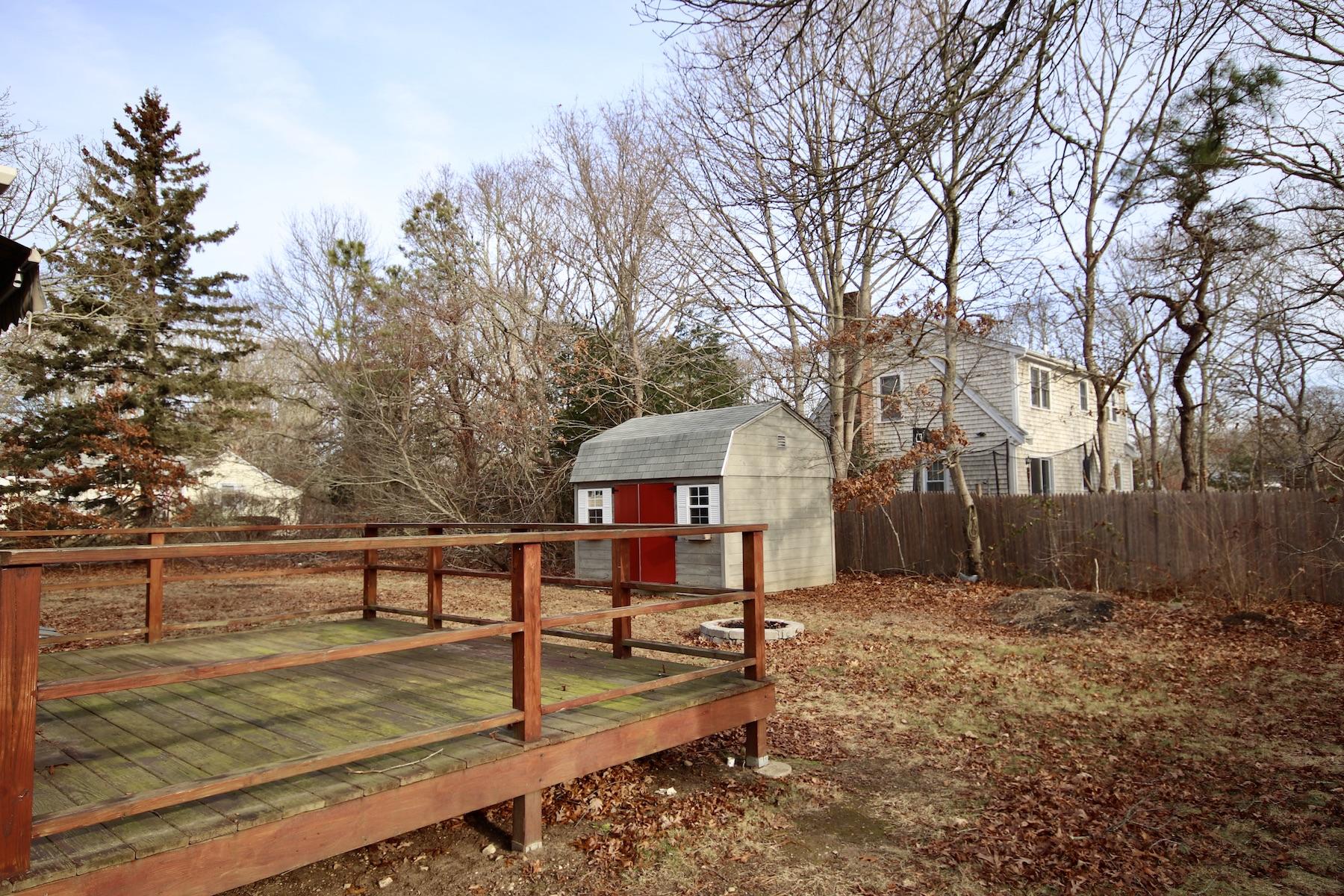 46 Fisher Road Hyannis, MA 02601 - Photo 23 of 29 a view of a backyard with a large tree
