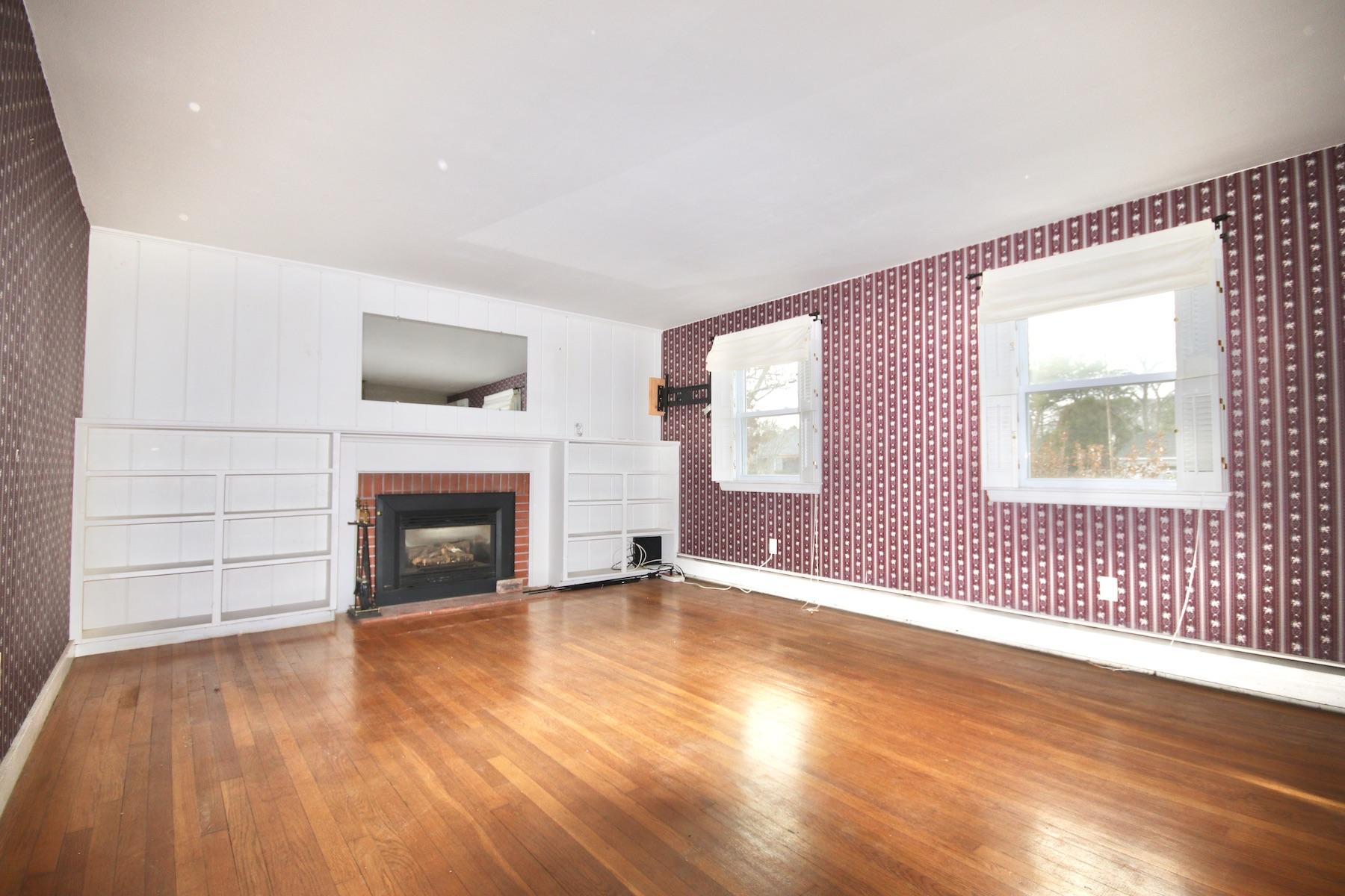 46 Fisher Road Hyannis, MA 02601 - Photo 3 of 29 wooden floor fireplace and windows in an empty room