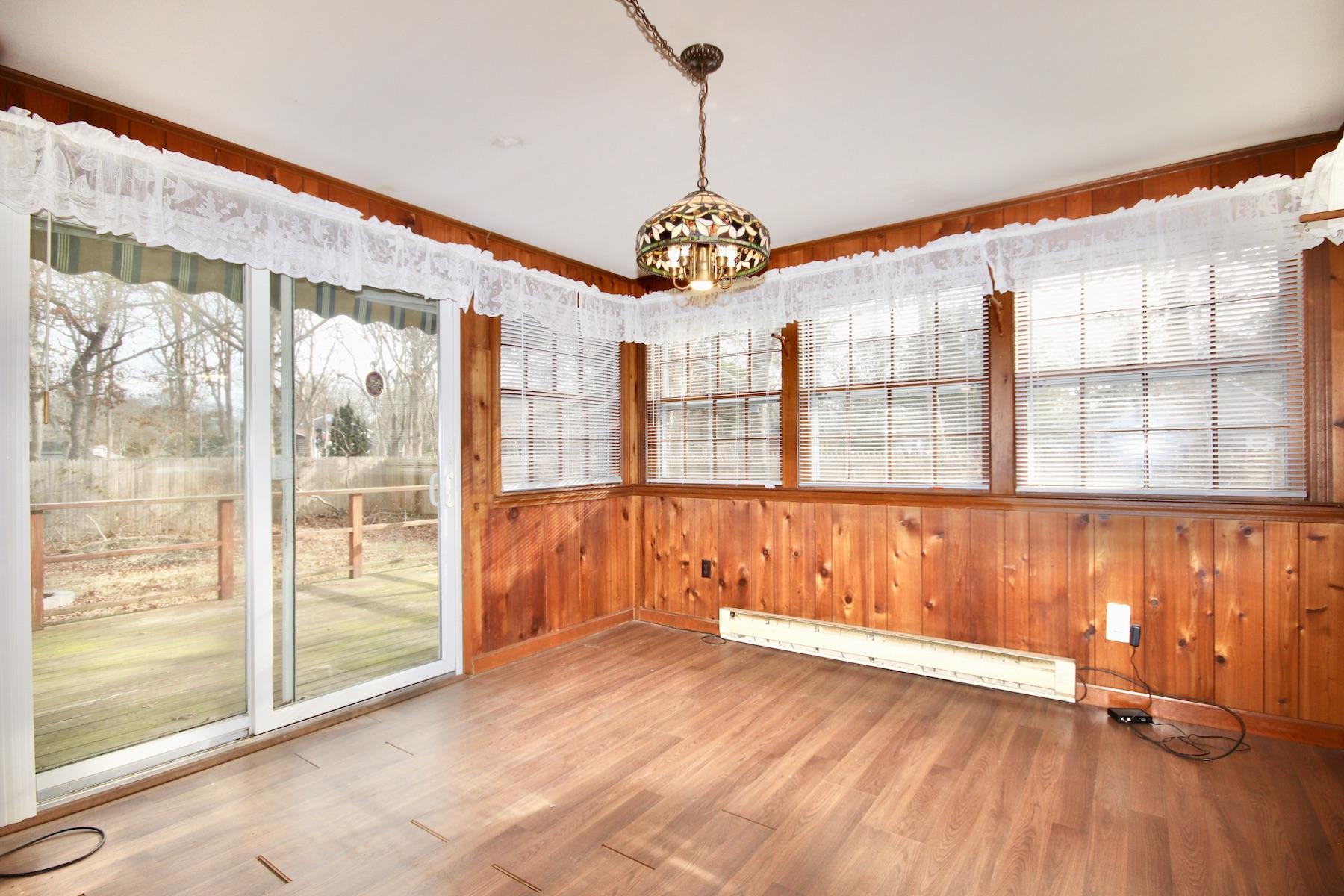 46 Fisher Road Hyannis, MA 02601 - Photo 10 of 29 a view of an empty room with wooden floor and a window