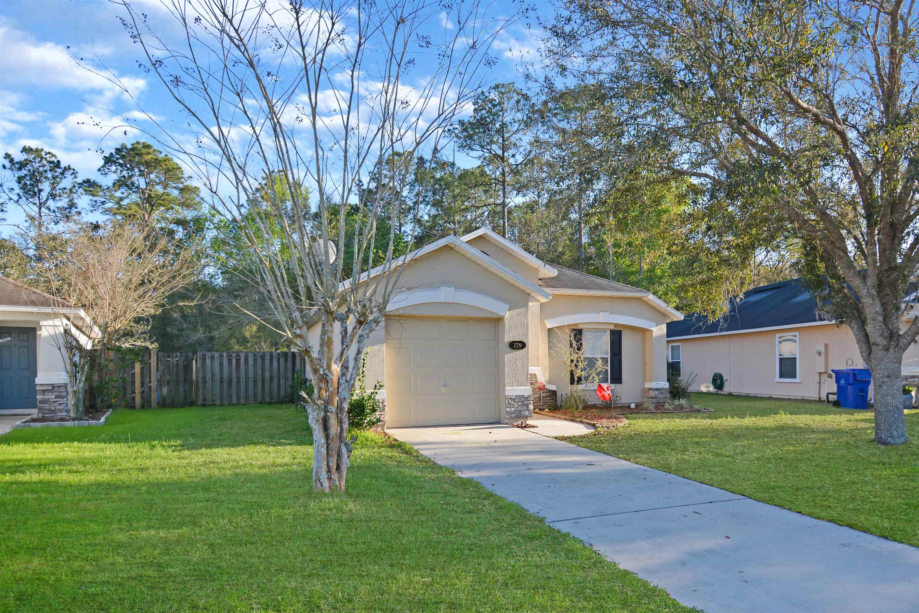 279 Buck Run Way St. Augustine, FL 32092 - Photo 2 of 28 a front view of house with yard and green space