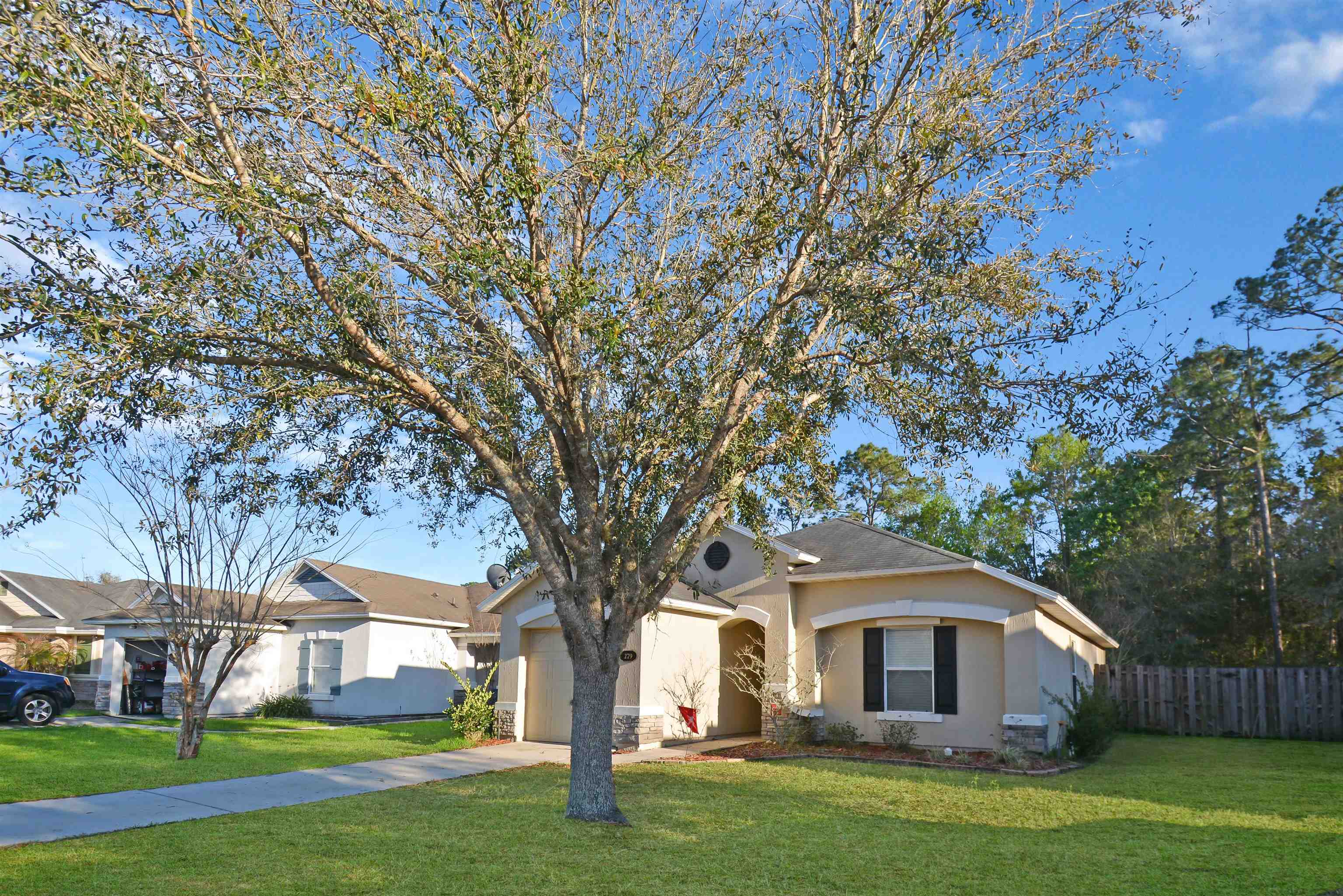 279 Buck Run Way St. Augustine, FL 32092 - Photo 3 of 28 a front view of house with yard and green space